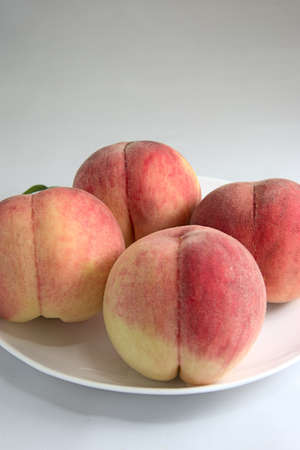 This sweet peach is cultivated in Japan.の写真素材