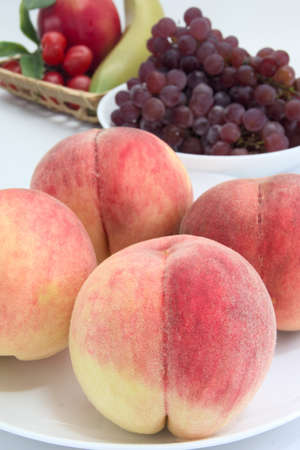 This sweet peach is cultivated in Japan.の写真素材