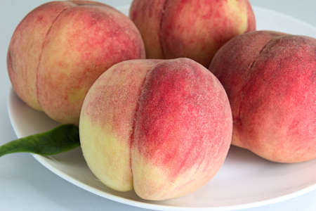 This sweet peach is cultivated in Japan.の写真素材
