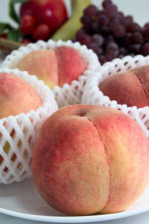 This sweet peach is cultivated in Japan.の写真素材
