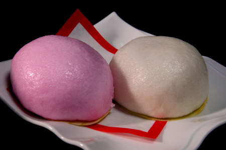 Red and white manju eaten in Japan in celebrationの写真素材