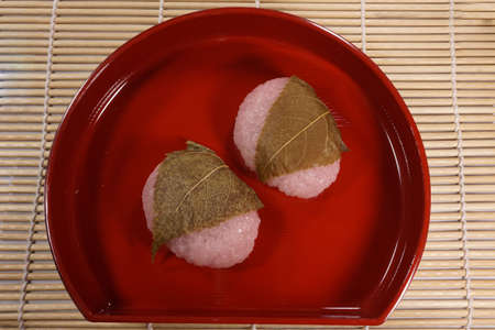 Sakura mochi wrapped in cherry leavesの写真素材