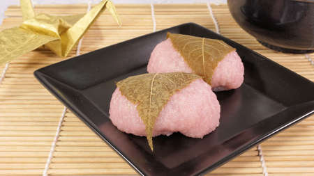 Sakura mochi wrapped in cherry leavesの写真素材
