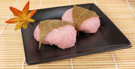Sakura mochi wrapped in cherry leavesの写真素材