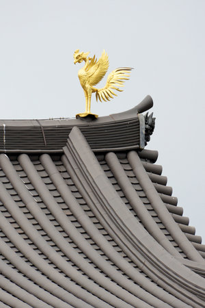 Golden Phoenix with a Tiled Roofの写真素材