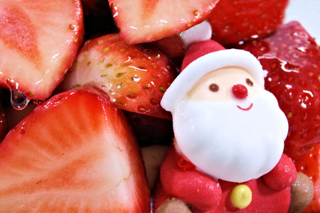 Strawberry with santa claus on white background, close upの写真素材