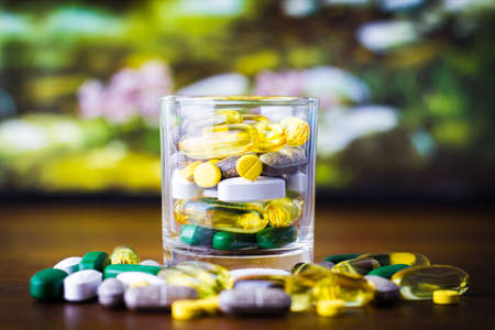 Drug prescription for treatment medication. Pharmaceutical medicament, cure in container for health. Pharmacy theme, capsule pills with medicine antibiotic in packages.の写真素材