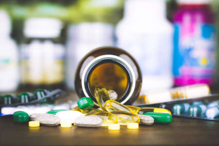 Drug prescription for treatment medication. Pharmaceutical medicament, cure in container for health. Pharmacy theme, capsule pills with medicine antibiotic in packages.の写真素材