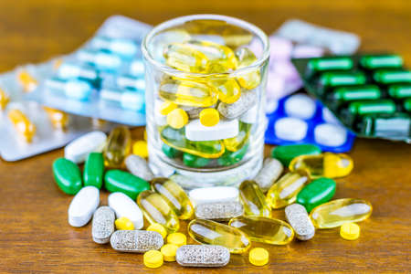 Drug prescription for treatment medication. Pharmaceutical medicament, cure in container for health. Pharmacy theme, capsule pills with medicine antibiotic in packages.の写真素材