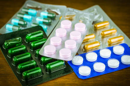 Drug prescription for treatment medication. Pharmaceutical medicament, cure in container for health. Pharmacy theme, capsule pills with medicine antibiotic in packages.の写真素材