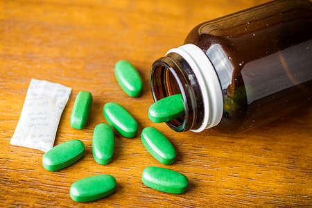 Drug prescription for treatment medication. Pharmaceutical medicament, cure in container for health. Pharmacy theme, capsule pills with medicine antibiotic in packages.の写真素材