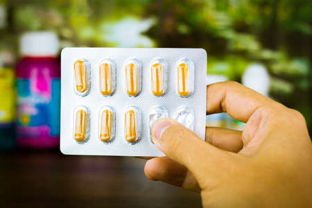 Drug prescription for treatment medication. Pharmaceutical medicament, cure in container for health. Pharmacy theme, capsule pills with medicine antibiotic in packages.の写真素材