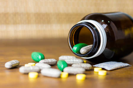 Drug prescription for treatment medication. Pharmaceutical medicament, cure in container for health. Pharmacy theme, capsule pills with medicine antibiotic in packages.の写真素材