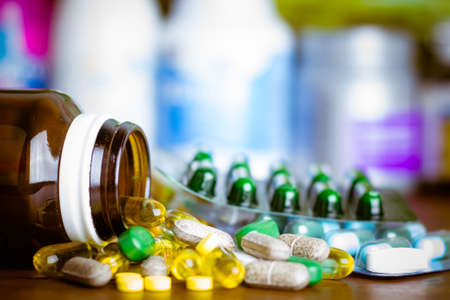 Drug prescription for treatment medication. Pharmaceutical medicament, cure in container for health. Pharmacy theme, capsule pills with medicine antibiotic in packages.の写真素材