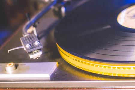 Close up at vintage gramophone. playing old song,Vintage record player with vinyl disc