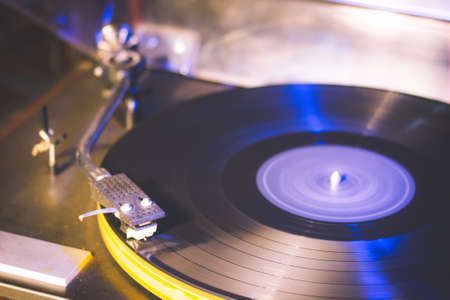 Close up at vintage gramophone. playing old song,Vintage record player with vinyl discの写真素材