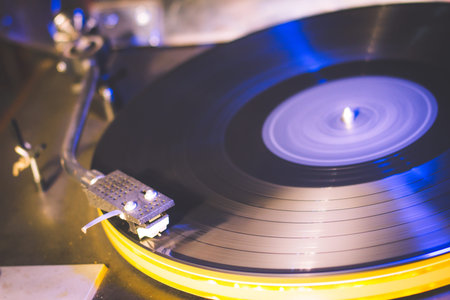 Close up at vintage gramophone. playing old song,Vintage record player with vinyl discの写真素材