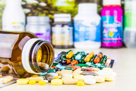 Drug prescription for treatment medication. Pharmaceutical medicament, cure in container for health. Pharmacy theme, capsule pills with medicine antibiotic in packages.closeup,Medicine or capsules.の写真素材