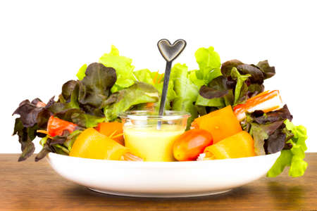 Close up of fresh salad of lettuce, cucumber and tomato on plate for healthy eating.Fresh vegetable salad in Black plate  on wood table. Salad for healthy. Fresh raw vegetables salad background.の写真素材