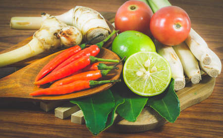 Various vegetables and seasoning cooking ingredients Tom Yum Soup or River Prawn Spicy Sour Soup (Tom Yum Goong) on  wooden background,Healthy eating and diet food concept.の写真素材