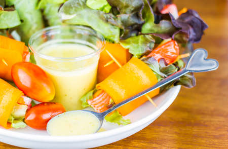 Close up of fresh salad of lettuce, cucumber and tomato on plate for healthy eating.
Fresh vegetable salad in Black plate  on wood table. Salad for healthy. Fresh raw vegetables salad background.の写真素材