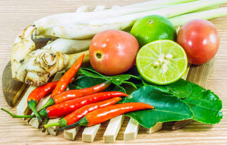 Various vegetables and seasoning cooking ingredients Tom Yum Soup or River Prawn Spicy Sour Soup (Tom Yum Goong) on  wooden background,Healthy eating and diet food concept.の写真素材