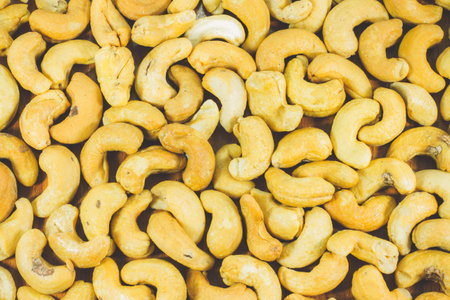 Close up of Roasted cashew nuts  for the background ,pattern ,texture, top viewの写真素材