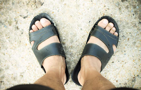 shoe foot on River stone , Stone background, Stone in the Park, Stone floor texture ,Sea stones backgroundの写真素材