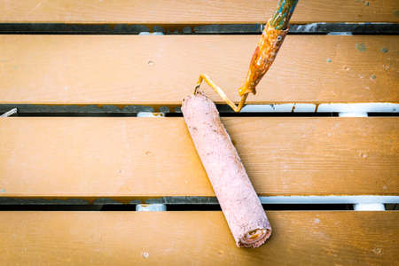 Painting of blue wall with paint rollerの写真素材