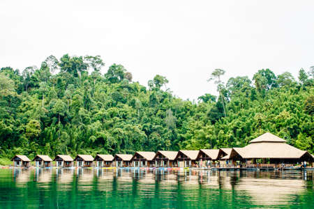 Resort wooden home raft floating and mountain fog on river kwai at sai yok,kanchanaburi,thailandのeditorial素材