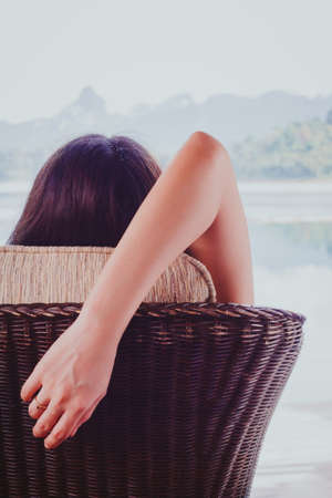 Woman relaxing on beach, ocean view with concept the Award of life with stay and relax the mind.の写真素材