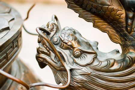 Close-up iron dragon head image in Chinese traditional style incense burner in Chinese templeの写真素材
