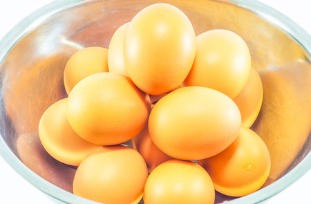 Eggs isolated on white background,Egg shells are brown skin beautifulの写真素材