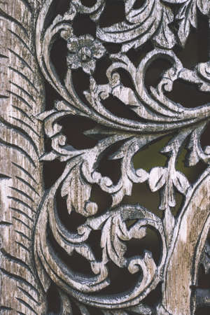 old element woodcarving. furniture in classic style.carving. small depth of field. luxury furniture.Wood processing. Joinery work. on the nature backgroundの写真素材