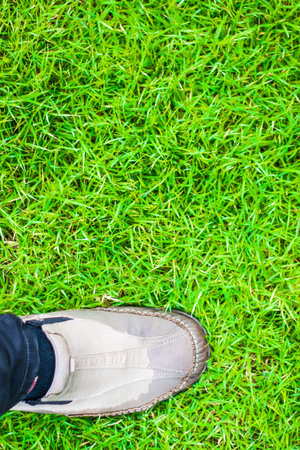 Selfie of foot and legs with leather shoes seen from above, vintage process