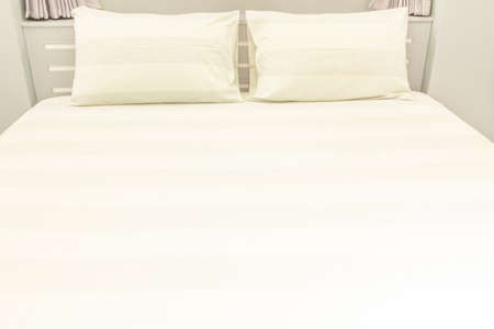 comfort and bedding concept - bed at home bedroomの写真素材