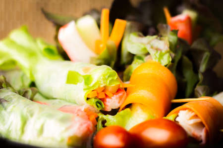 Close up of fresh salad of lettuce, cucumber and tomato on plate for healthy eating.
Fresh vegetable salad in Black plate  on wood table. Salad for healthy. Fresh raw vegetables salad background.の写真素材