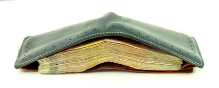 black leather wallet with money isolated on white background の写真素材