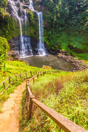 Beautiful view of waterfall landscape. Small waterfall in deep green forest sceneryの写真素材