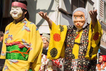 Japanese mask funny characters in the parade のeditorial素材