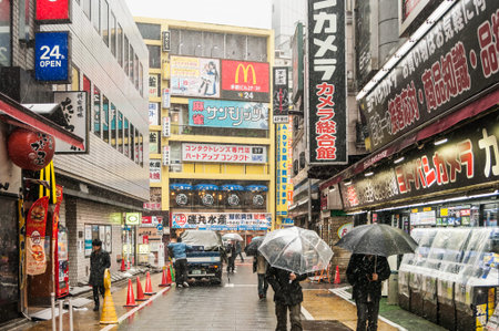 Shinjuku, Japan - February 14, 2014  Japanese people walks on the street during snow storm in...