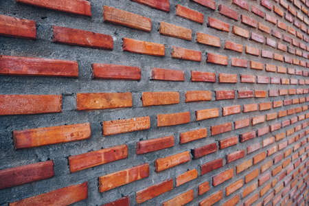 Red brick wall background. colorful horizontal architecture.の写真素材