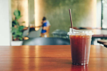 Black ice coffee or Americano coffee on wood table.の写真素材