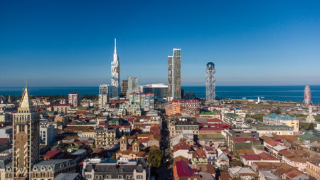 Panoramic view of a coastal city on a sunny dayの写真素材