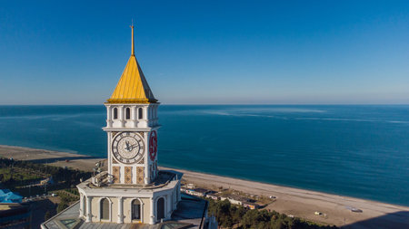 Aerial view of the old clock tower on the background of the sea