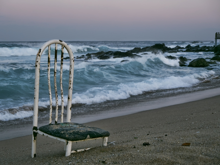 Old chair on a deserted beach. Sokcho city. South Koreaの写真素材