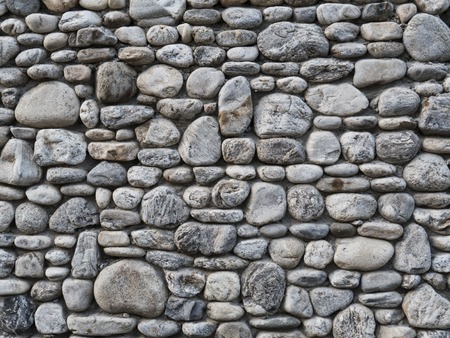 Grey stone wall as a background textureの写真素材
