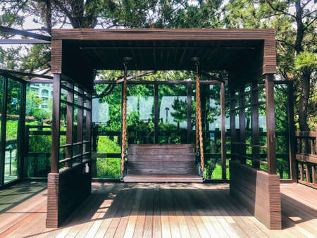 Wooden swings in a garden. Front view. Jeju islandの写真素材