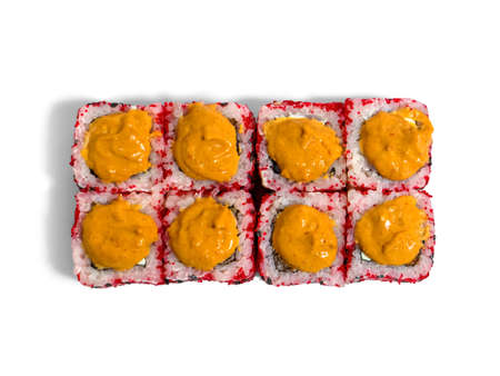 Uramaki roll isolated on white background. Japanese sushi roll with red caviar, black sesame and sauce.の写真素材