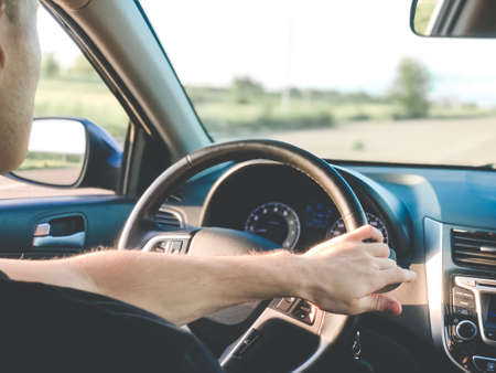 The man is driving the car. Photo from the carの写真素材